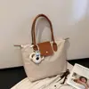 2026 Nueva Moda Popular Elegante Estilo Coreano Personalidad Ins Bolso Casual Bolso Tote de Hombro Axila Bolso Cruzado para Mujer