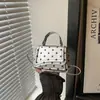 Bolsa feminina de ombro único, transversal, de mão, simples e moderna, com poá, 2026, nova e fresca para o outono, de grande capacidade, pequena e quadrada, fashion