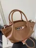 Bolso Cubo de Moda de Nicho 2026 Primavera Nueva Moda Estilo Coreano Bolso de Hombro Bolso Cruzado de Alto Valor para Mujer