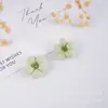 Jiangsu Yancheng Dafeng Ximing Fabricante de Accesorios para Ropa Flores Pequeñas Hechas a Mano Flores de Tela Pequeñas Rellenas de Algodón Estéreo