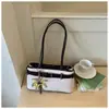 Bolso de axila de estilo francés de nicho transfronterizo para mujer, nuevo bolso sencillo de alta gama para el día a día, bolso de hombro y bolso de mano versátil, al por mayor