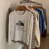 Camiseta feminina de algodão puro de manga longa plus size, novo estilo para o início do outono de 2026, corte solto, modelagem que afina, cobre a barriga, peça externa, camiseta básica