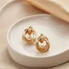 Pendientes de Metal con Temperamento Europeo y Americano para Mujer Círculo Dorado Nicho Lujo Ligero Moda Pendientes de Gama Alta Venta al por Mayor
