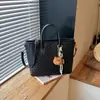 Bolso tote grande minimalista retro transfronterizo para mujer, nueva colección otoño 2026, moderno y sofisticado, versátil para ir al trabajo y uso diario, se puede llevar como bolso de hombro o bolso cruzado