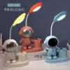 Luz de noite criativa de astronauta LED porta-canetas multifuncional lâmpada de estudo com carregamento USB lâmpada de cabeceira atacado