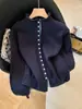 Cárdigan de punto de alta calidad, moderno, único, súper elegante, con bloques de color y cuello alto para mujer, top interior para otoño e invierno de Guangzhou Thirteen Lines