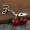 Bolsa de Joyería de Moda para Mujer de Venta Caliente Transfronteriza Colgante Colgante de Cereza de Resina Roja Llavero de Cereza Brillante Decoración