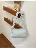 Bolso tipo almohada plisado de diseño de nicho estilo coreano para mujer, nuevo artículo de moda popular para el verano 2026, se puede llevar al hombro o cruzado