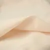 La tela de capa base para mujer 50D de elasticidad en cuatro direcciones se ajusta al cuerpo y es cómoda sin hacer bolitas.