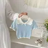 2026 Novo Top de Tricô de Verão para Meninas com Gola Reversível Estilo Coreano com Design Vazado, Suéter Fino Doce e Versátil de Manga Curta para Bebê