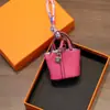 Colgante de minibolso de cesta, llavero de coche de cuero de alta calidad, funda para auriculares, decoración creativa para coche, venta al por mayor