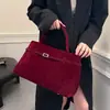 Bolso de mano y hombro de ante retro versátil de diseño transfronterizo, mismo estilo que los bolsos de influencers populares
