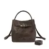 Bolso de Mano Retro Estilo Coreano para Commuter para Mujer 2025 Nuevo Bolso Cruzado de Hombro Casual Cubo de Alta Gama Versátil