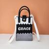Bolso para teléfono móvil de alta gama Ins Nuevo Bolso tejido casual para mujer Bolso de mano Moda Versátil Tejido Popular Bolso cuadrado pequeño