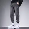 Venta al por mayor transfronteriza nuevos jeans para hombre estilo americano marca de moda casual pierna cónica pantalones largos holgados versátiles pantalones cargo de retazos