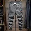 Pantalones de primavera y otoño construcción nueva moda todo partido moda marca overoles niños tobillo atado hombres trabajo casual pantalones Primavera