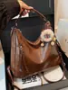 Mochila vintage, novo modelo transfronteiriço, bolsa de ombro estilosa para o dia a dia, bolsa tote crossbody, bolsa de mão casual de grande capacidade, versátil e moderna