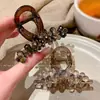 Pinza para el pelo de cristal colorida de alta gama y moda 2026 para mujer, elegante accesorio para el pelo de estilo coreano y japonés para la parte trasera de la cabeza, tocado de moda y versátil