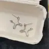 Pendientes de Estrella Irregular Geométrica de Cuatro Puntas de Nuevo Estilo para Mujer con un Diseño de Nicho, Aspecto de Alta Gama, Pendientes Simples y Elegantes para Mujer