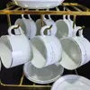 Conjunto de Xícara e Pires para Café Estilo Coreano Transfronteiriço Xícara de Café Branca Pura Xícara de Cerâmica Conjunto de Xícara e Pires para Café para Home Office Venda por Atacado