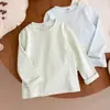 Camiseta interior de algodón puro de manga larga para niños, estilo primavera y otoño, camiseta de cuello redondo para niños y niñas, top suave para bebés, disponible en varios colores