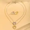 Collar y anillo únicos de estilo europeo y americano con forma de ciempiés y corazón, colgante de corazón hueco de nicho, anillo abierto para el dedo índice con ciempiés entrelazado.