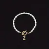 Pulseira de Moda 2026 Mais Vendida no Exterior com Diamantes e 26 Letras, Pulseira de Contas com Pérolas Artificiais em Formato Oval, Disponível para Atacado para Mulheres