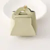 Nuevo Monedero Creativo Color Caramelo Llavero de Auriculares Moda Femenina Bolso de Almacenamiento de Cuero Versátil Colgante Regalo
