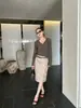 Falda Recta de Cuero PU Retro Wanwei para Mujer 2026 Otoño Nuevo Estilo Puntada Vertical Dividida Falda de Cuero Línea A 0298