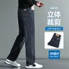 Venta al por mayor de jeans gruesos con forro polar para otoño e invierno para hombre, pantalones de pierna ancha de cintura alta, pantalones casuales de negocios rectos holgados y elásticos para hombre