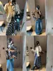 Diseño Streetwear Moqie Cuello Alto Botón Asimétrico Cintura con Cordón Silueta Holgada Chaqueta MQ1943