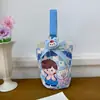 Venta al por mayor del fabricante Bolso de mano artístico de moda Bolso de lona Bolso tipo cubo de gran capacidad para mujer 2026 Nuevo Bolso para almuerzo de trabajo