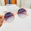 Venta directa de fábrica gafas de sol para niños montura redonda coreana anti-ultravioleta montura de gelatina colorida gafas de orejas de gato gafas de sol