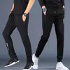Calça esportiva casual masculina nova e moderna de outono, com bolsos, tamanho grande, calça jogger com zíper, calça de moletom de perna reta