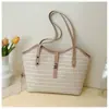 Bolso de hombro de gran capacidad para vacaciones en la playa de comercio exterior, bolso simple y moderno para debajo del brazo, bolso tote de alta gama tejido a mano