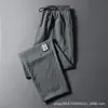 Pantalones de aire acondicionado exclusivos de seda helada transfronterizos, finos, talla grande para hombre, holgados, transpirables, de secado rápido, casuales, de pierna recta, estilo jogger, largos