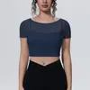 Camiseta deportiva de malla sintética tipo dos piezas disponible en stock con mangas cortas y almohadillas en el pecho, top de yoga, top corto, ropa de fitness adelgazante de secado rápido