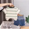 Conjunto de Verano para Niños 2026 Estilo Nuevo para Niños de Moda Bolsillo de Dibujos Animados Manga Corta Bebé Deportivo Conjunto de Dos Piezas Venta al por Mayor