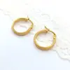 Pendientes redondos de acero de titanio de alta calidad europeos y americanos, temperamento nicho, pendientes geométricos de acero inoxidable de oro de 18 quilates, venta al por mayor para mujer