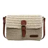 Bolsos pequeños tejidos de moda para primavera y verano para mujer 2026 nueva moda bolsos de paja para playa versátiles bolsos de hombro y cruzados texturizados
