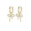Exquisitos y pequeños pendientes con forma de micro lazo y hebilla para las orejas, para mujer, de alta gama, con un toque dulce y novedoso.