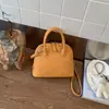 Bolso de mujer 2026 nuevo de moda primavera alta calidad bolso de mano tipo concha para el trabajo y el trayecto, bolso de hombro y cruzado
