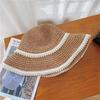 Un sombrero de paja de perla tejido; un sombrero de paja ligero a prueba de sol adecuado para viajes diarios, vacaciones y turismo.