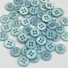Al por mayor en stock Botones de concha natural 10 mm Color caramelo Accesorios de ropa DIY Botones de concha de agua dulce natural