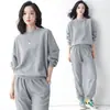 Traje casual de punto gofre estilo simple para mujer primavera otoño moda sudadera de manga larga cuello redondo bolsillo puño elástico pantalones de chándal dos piezas