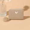 Cartera de mujer con borla de pelo y cremallera versión coreana de todo-partido simple acolchada con costura decorativa de mariposa cartera corta al por mayor