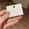 Aretes de botón con cuatro garras incrustados de diamantes diseño de nicho sentido del temperamento aretes de plata estilo nuevo alta gama moda joyería de oreja versátil para mujeres