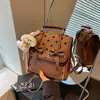Mochila de lunares con lazo transfronteriza para mujer, nueva y versátil bolsa escolar para estudiantes 2026, bolso de mano para el trabajo, bolso de hombro, bolso cruzado
