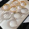 Pulsera Retorcida de Metal Irregular de Venta Caliente Transfronteriza Europea y Americana Estilo Ins Pulsera de Tacto de Alta Gama Sentido de Diseño de Nicho Joyería de Mano