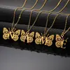Nuevo collar de acero inoxidable de Amazon con colgante de alas de mariposa para mujer, 26 letras en inglés, mariposa hueca, collar de acero de titanio